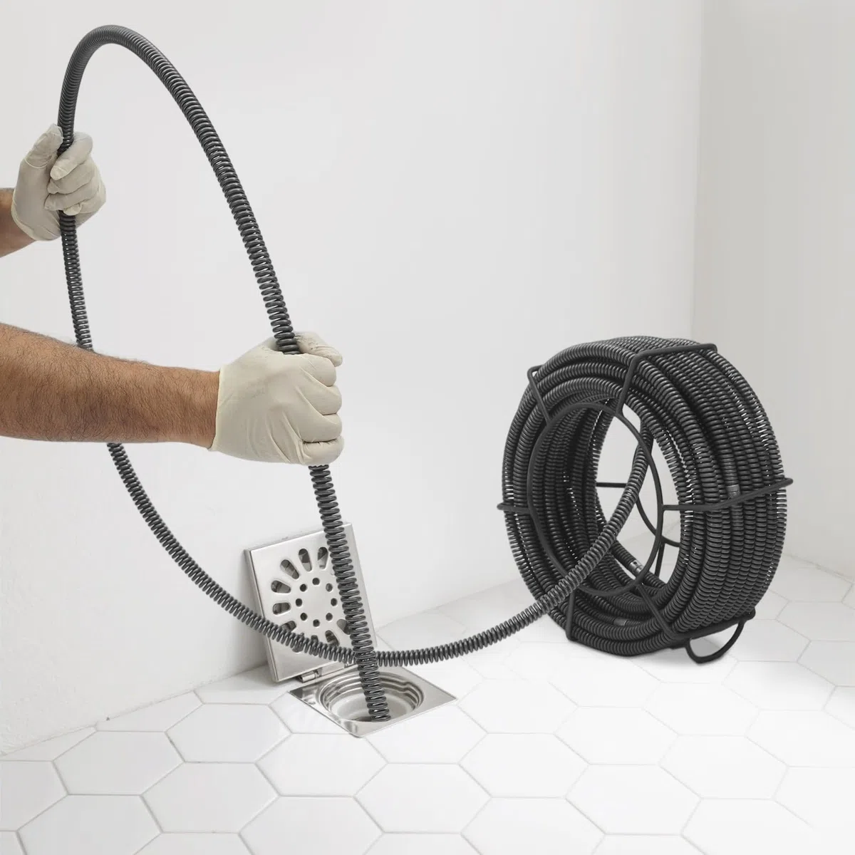 Spirale de nettoyage de tuyaux Ø 16 mm + 20 m, spirale à ressort, déboucheur de canalisations avec support de rangement, pour débarrasser les canalisations